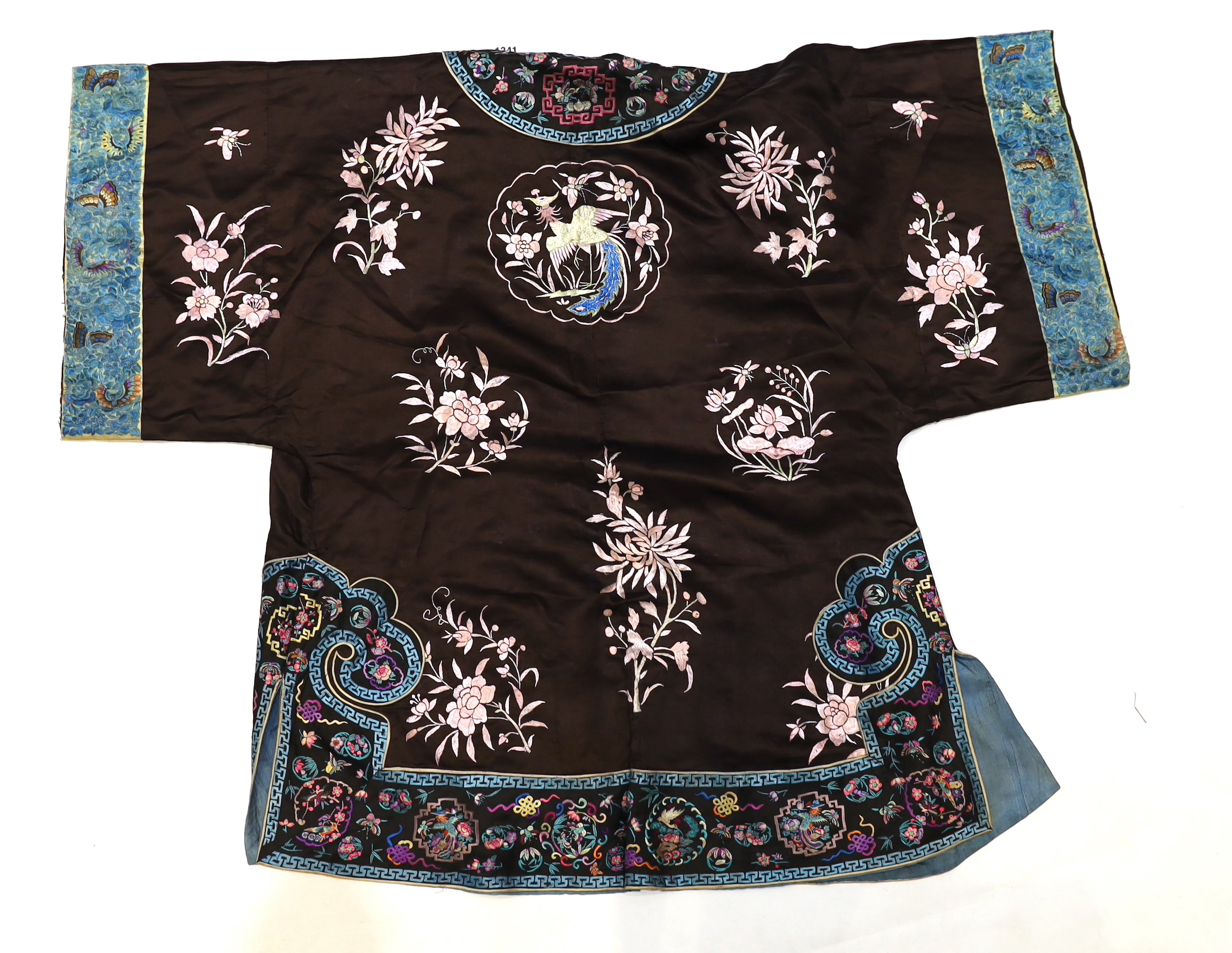 A Chinese early Republic blue silk embroidered robe with colourful ornately embroidered sleeve bands and borders to the robe